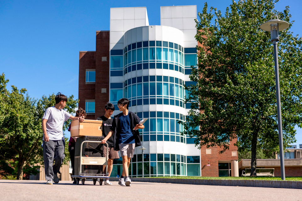students walk down path on first day of class