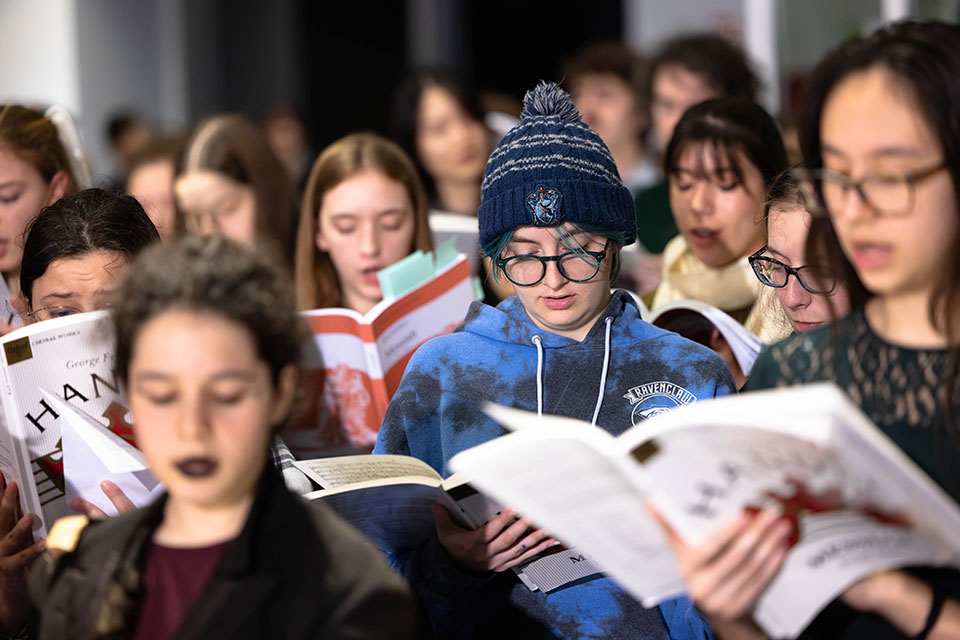 A close-up view of students singing at the holiday concert.